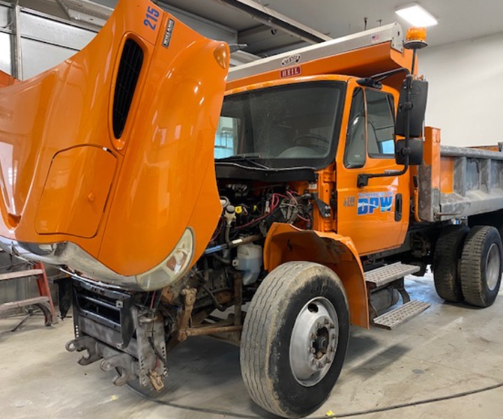 Orange color truck bonnet open